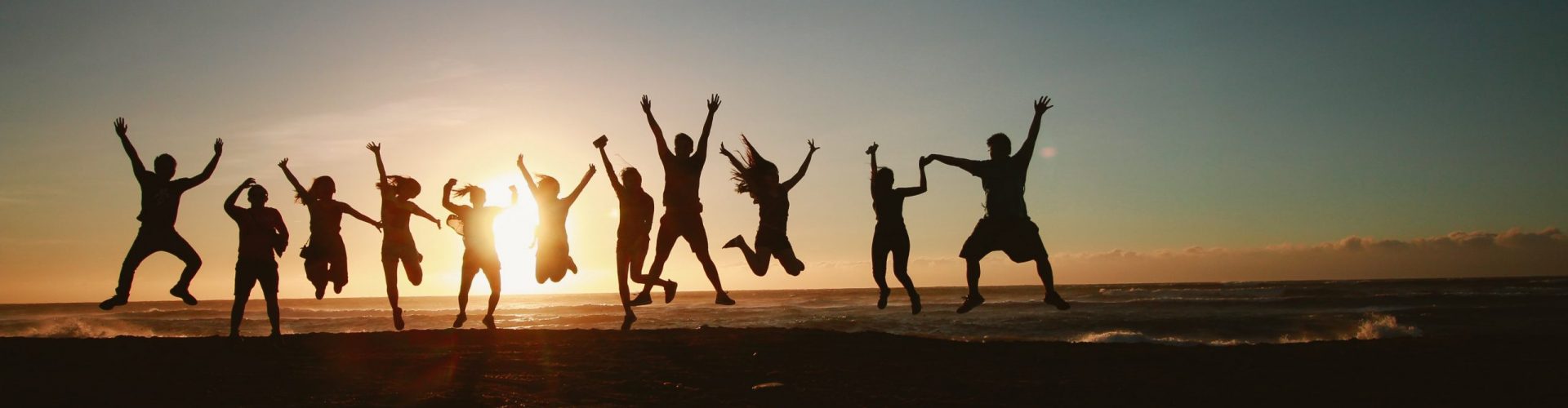 silhouette-photography-of-group-of-people-jumping-during-1000445